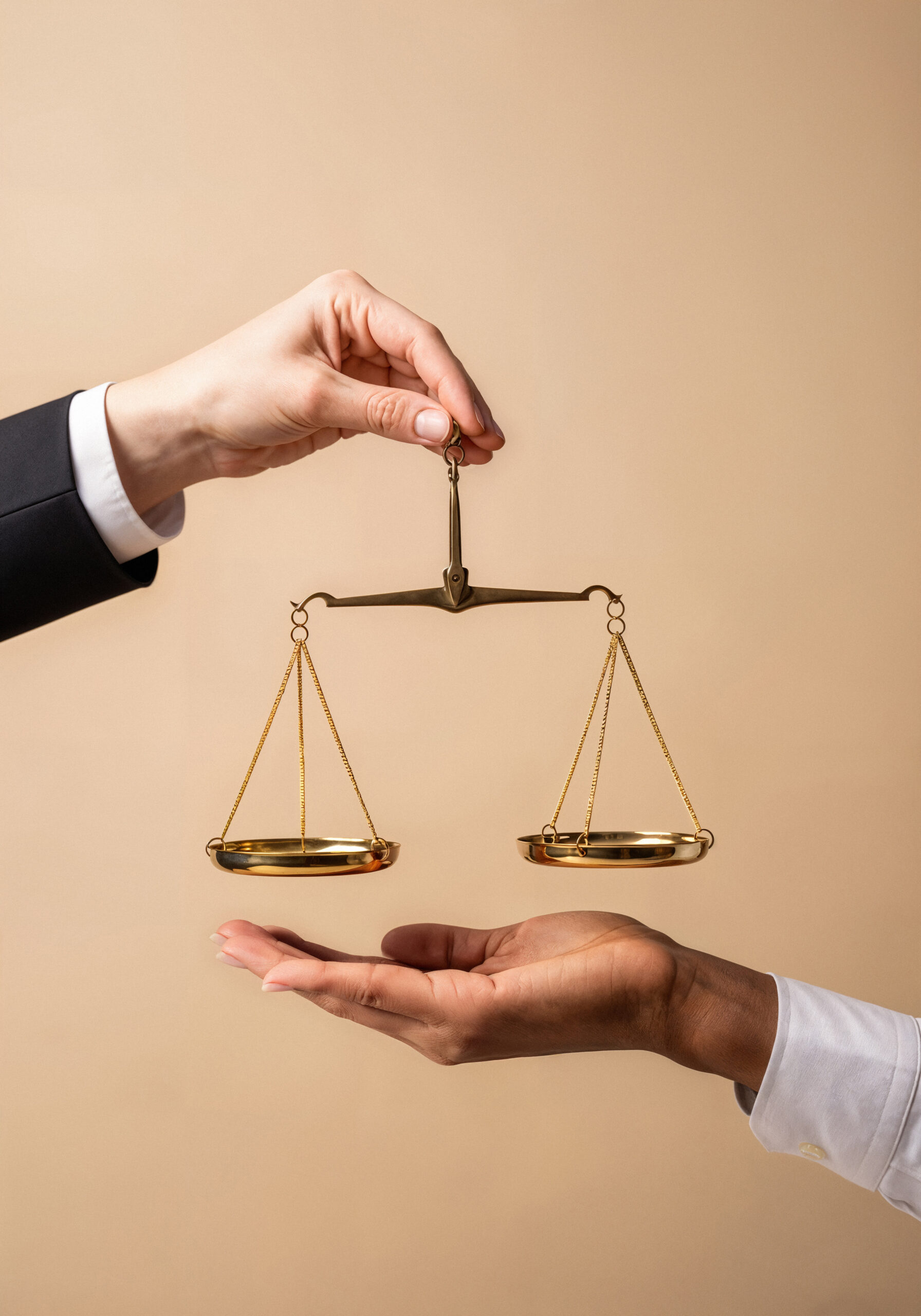 balance-scale-held-by-two-hands